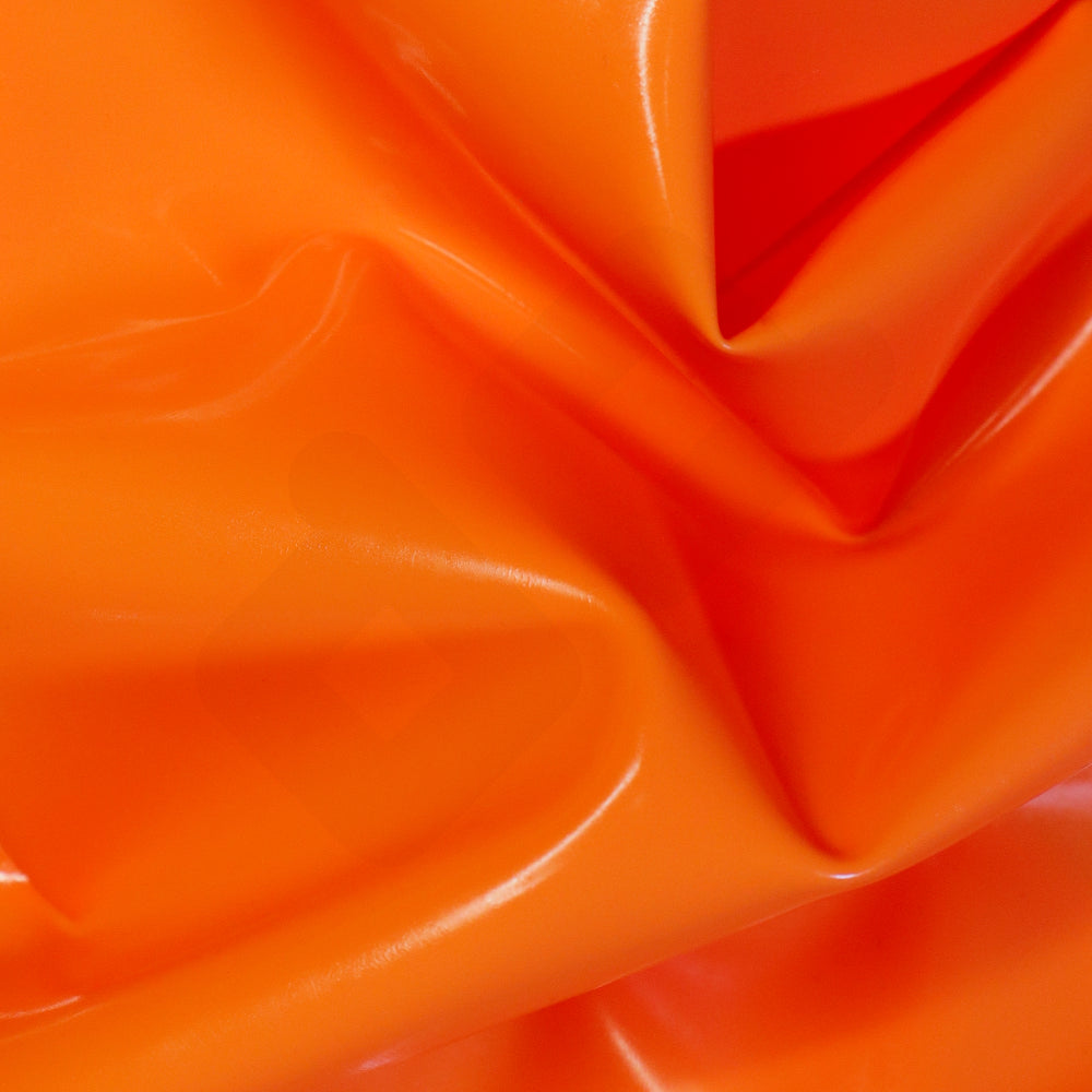 Close-up of a shiny orange latex sheet