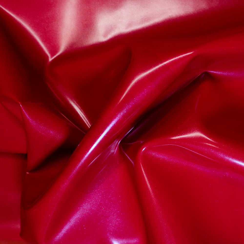 Close-up of a shiny red metallic latex sheet